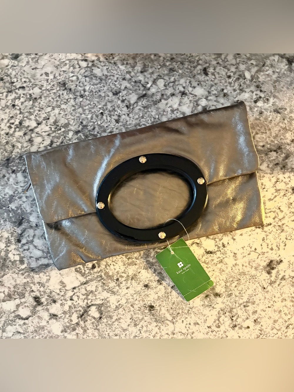 Brand New Kate spade metallic leather  plaque clutch
